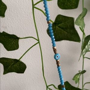 blue evil eye bracelet.